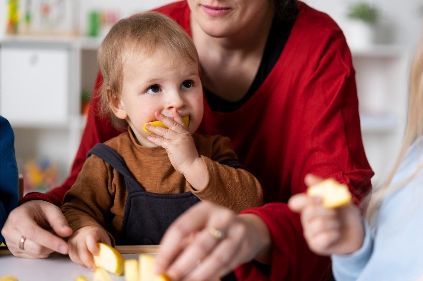 Therapist guiding a child through a feeding session